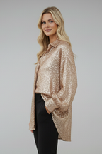Phaelin | Glanzende damesblouse met oversized pasvorm en lange mouwen